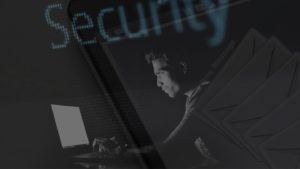 image of person on computer in shadows