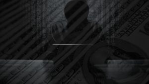 ransomware image of hooded hacker